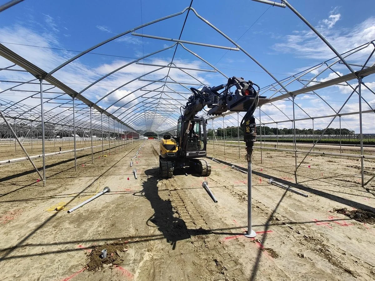 Screw pile foundation installation for berry farm polytunnel structures in Massachusetts, USA