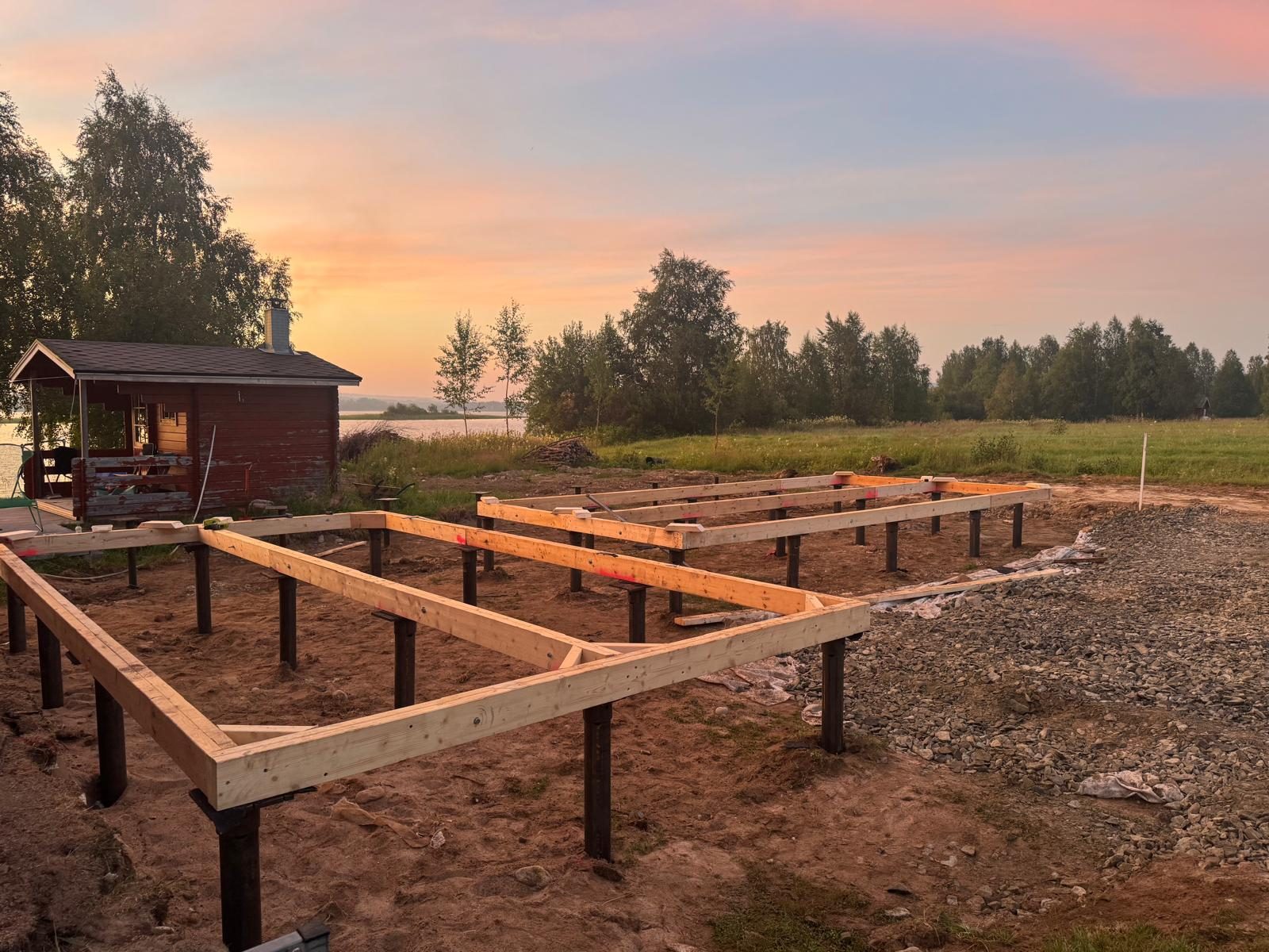 Completed cabin timber frame on screw pile foundation grid