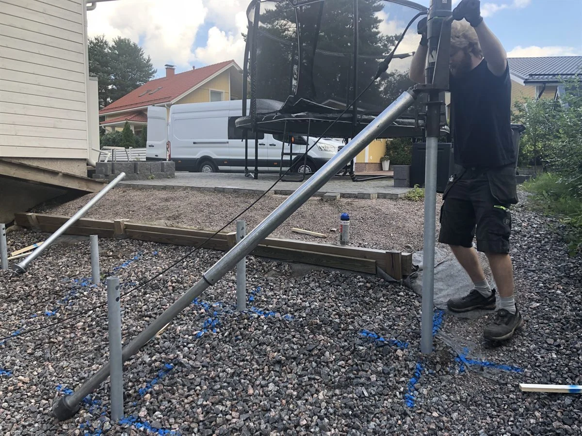 Deck foundations with screw piles